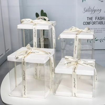 Custom Clear PVC Cake Display Gift Box | White Cardboard Lid & Base Satin Ribbon Bow Multi-Height Sizes for Birthday Cake Dessert Flower Gift Brand Packaging | MOQ 100 pcs