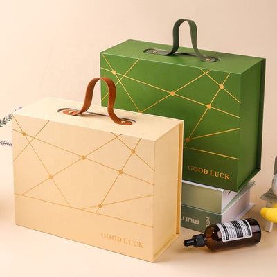 Custom Gold Geometric Line Magnetic Book-Style Gift Box with Leather Handle | Cream White Gold Forest Green Gold Foil Grid & Good Luck Stamp Brown PU Leather Handle for Beauty Tea Health Holiday Gift Set | MOQ 100 pcs