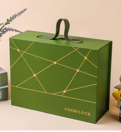 Custom Gold Geometric Line Magnetic Book-Style Gift Box with Leather Handle | Cream White Gold Forest Green Gold Foil Grid & Good Luck Stamp Brown PU Leather Handle for Beauty Tea Health Holiday Gift Set | MOQ 100 pcs