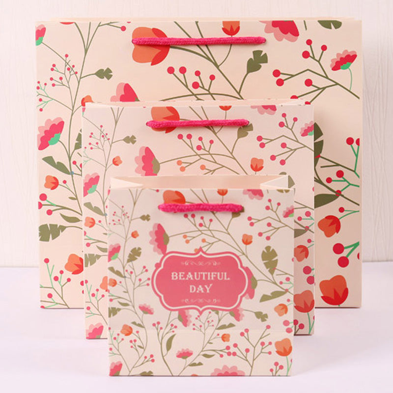 Eco Wholesale New Product New Year Paper Gift Bag Recyclable Custom Logo For Spring Festival Holiday Candy Snack Gift Pack