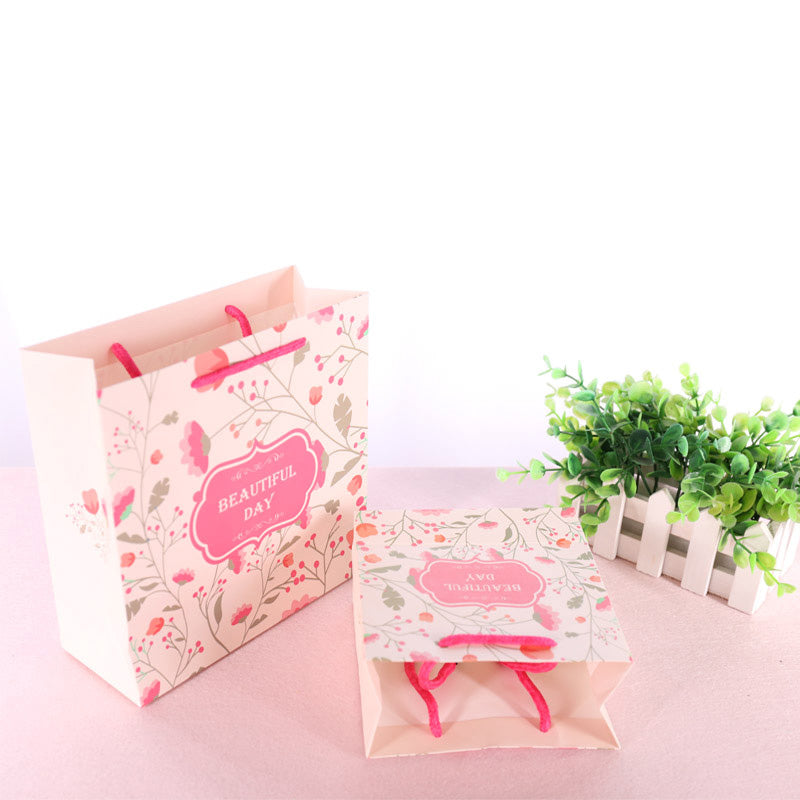 Eco Wholesale New Product New Year Paper Gift Bag Recyclable Custom Logo For Spring Festival Holiday Candy Snack Gift Pack