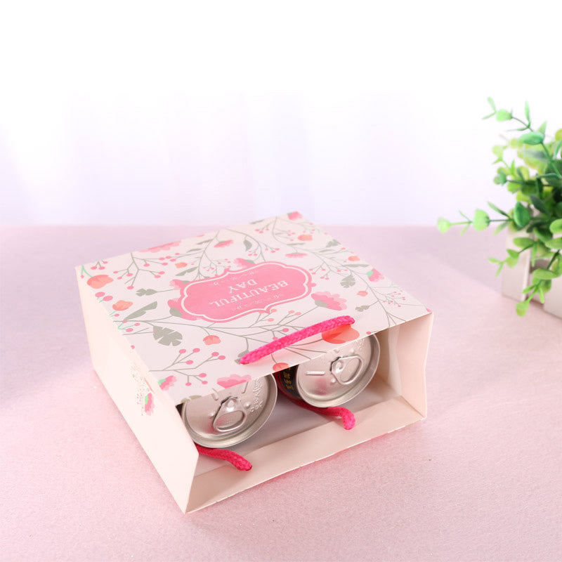 Eco Wholesale New Product New Year Paper Gift Bag Recyclable Custom Logo For Spring Festival Holiday Candy Snack Gift Pack