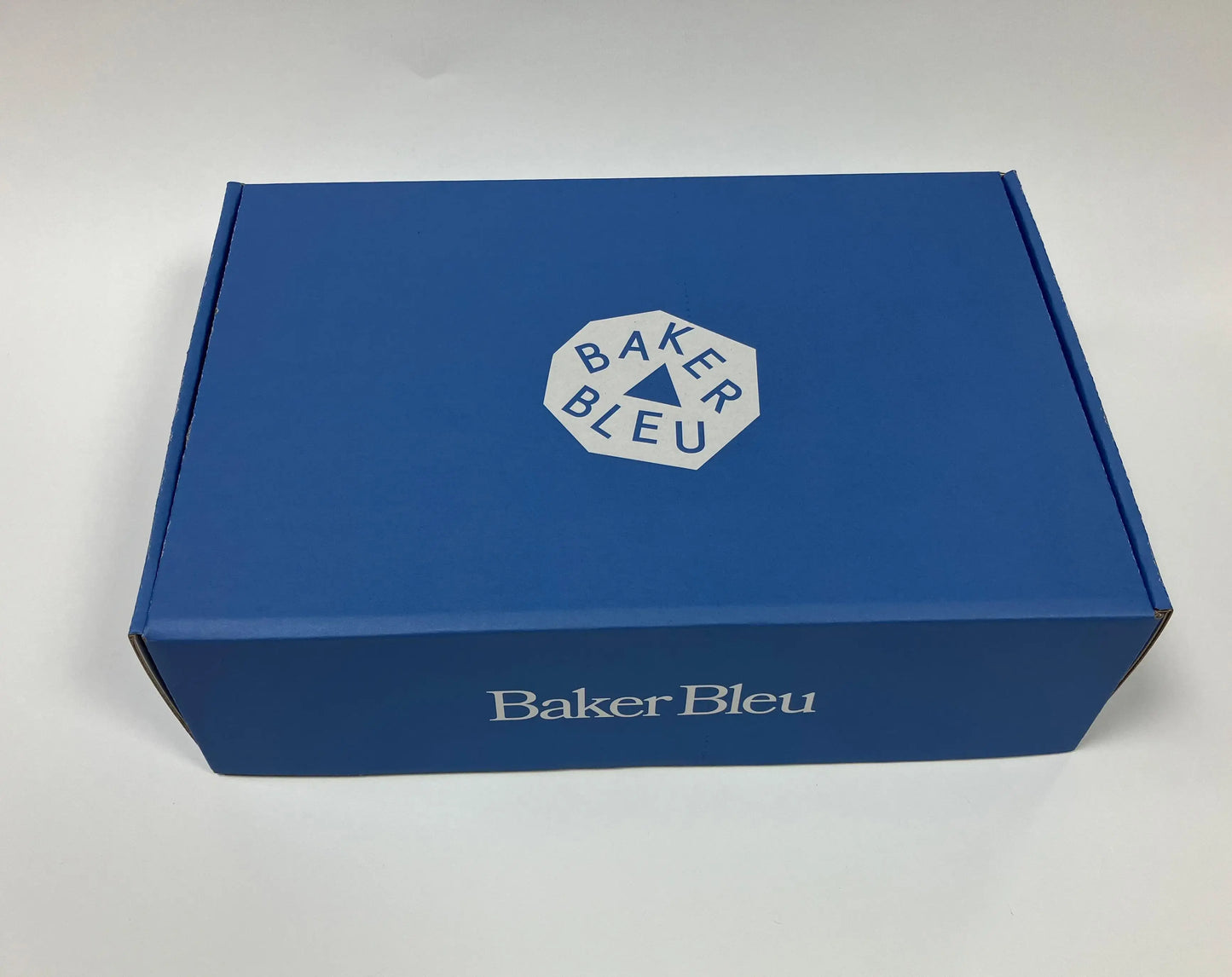 White Card Auto-Lock Bottom Box with Yellow Blue Patterns Matte Lamination Recycled Materials Biodegradable Customizable Sizes