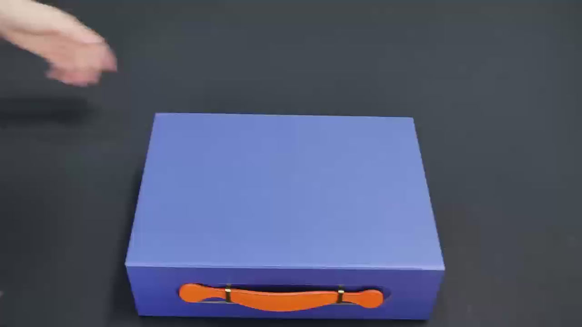 Custom Two-Tone Foldable Magnetic Gift Box | Leather Strap Handle Navy Blue & Orange for Luxury Fashion Corporate & Holiday Gifts | MOQ 100 pcs